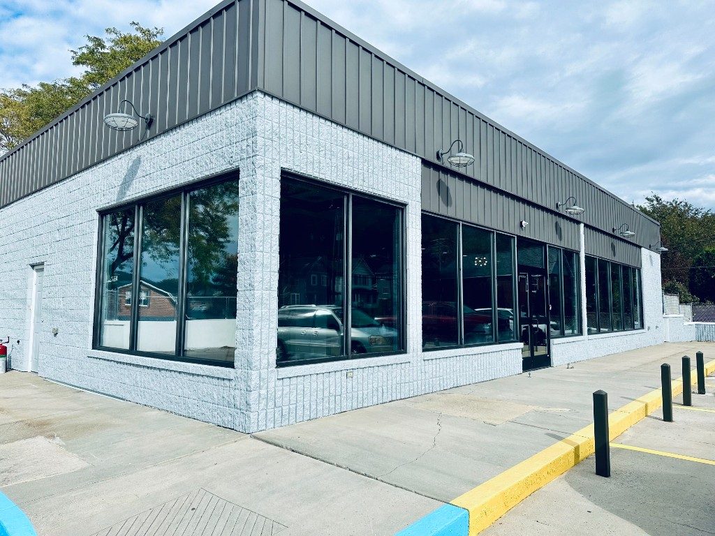 Commercial storefront with dark architectural window tint by Black Label Tint