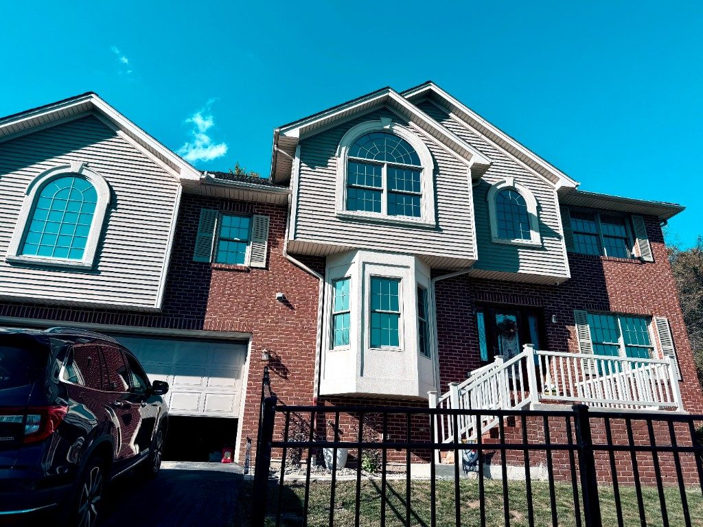 Residential home with reflective house window tint by Black Label Tint